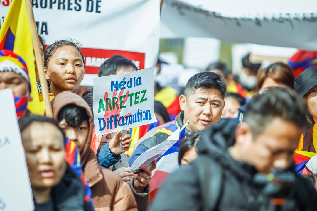 a large group of people holding signs and flags
