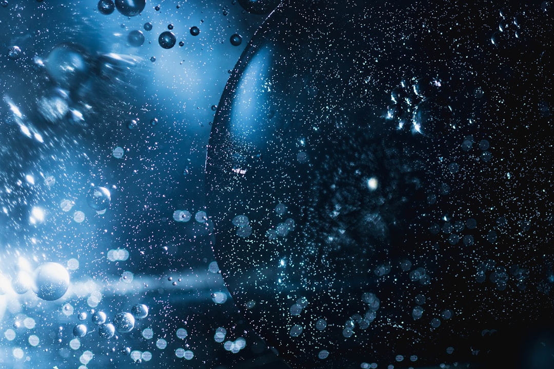 a close up of water droplets on a glass